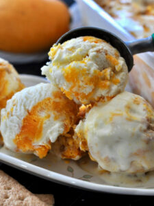 3 mango cheesecake ice cream scoops.