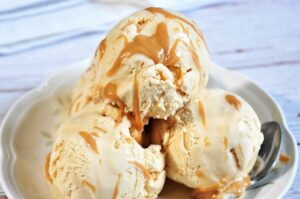 Salted Caramel ice-cream scoops in a plate.