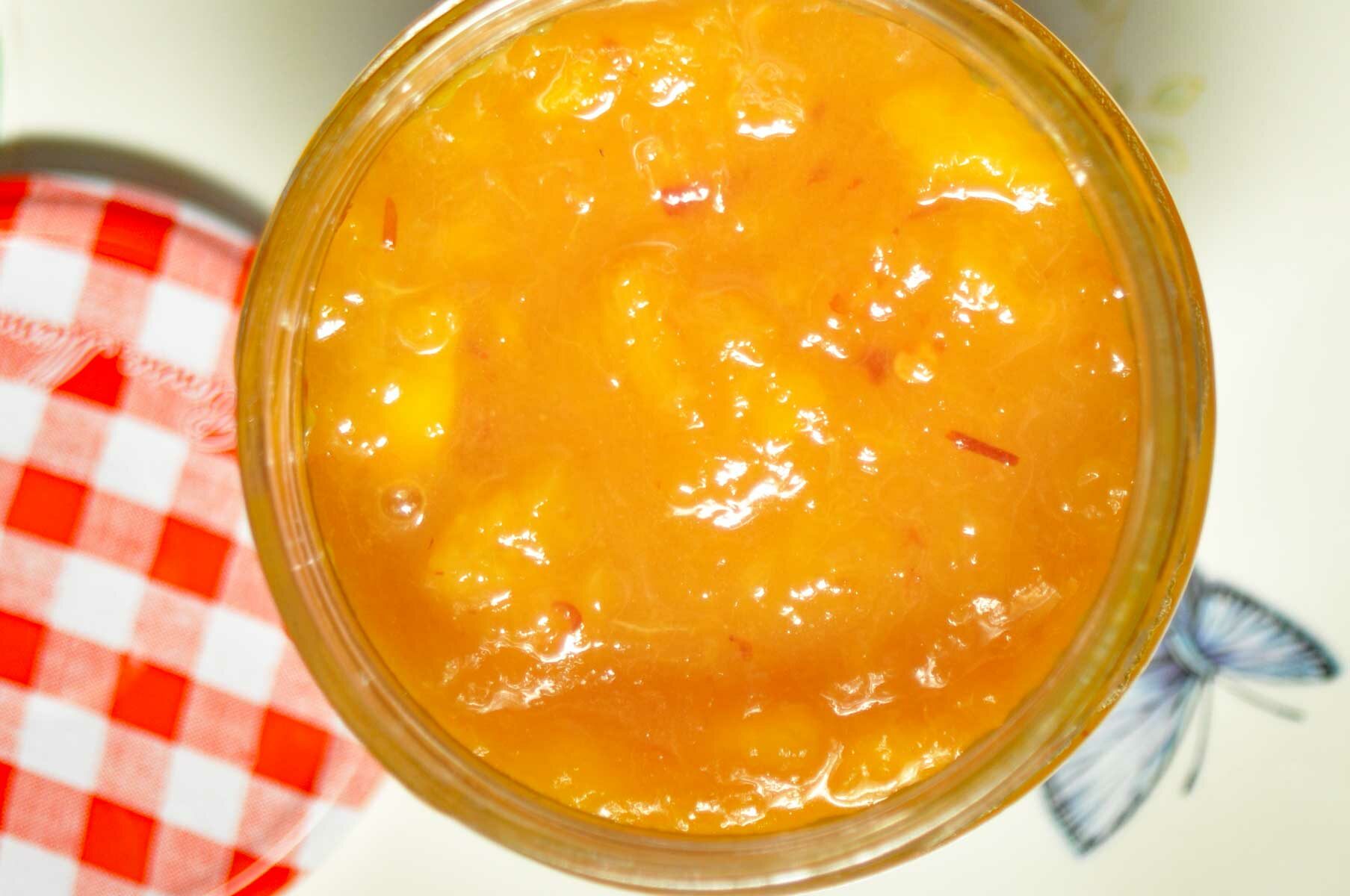 Peach jam in a jar.