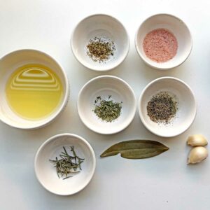 Orzo pasta soup ingredients in bowls.