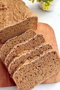 Sprouted wheat flour bread slices on a cutting board.