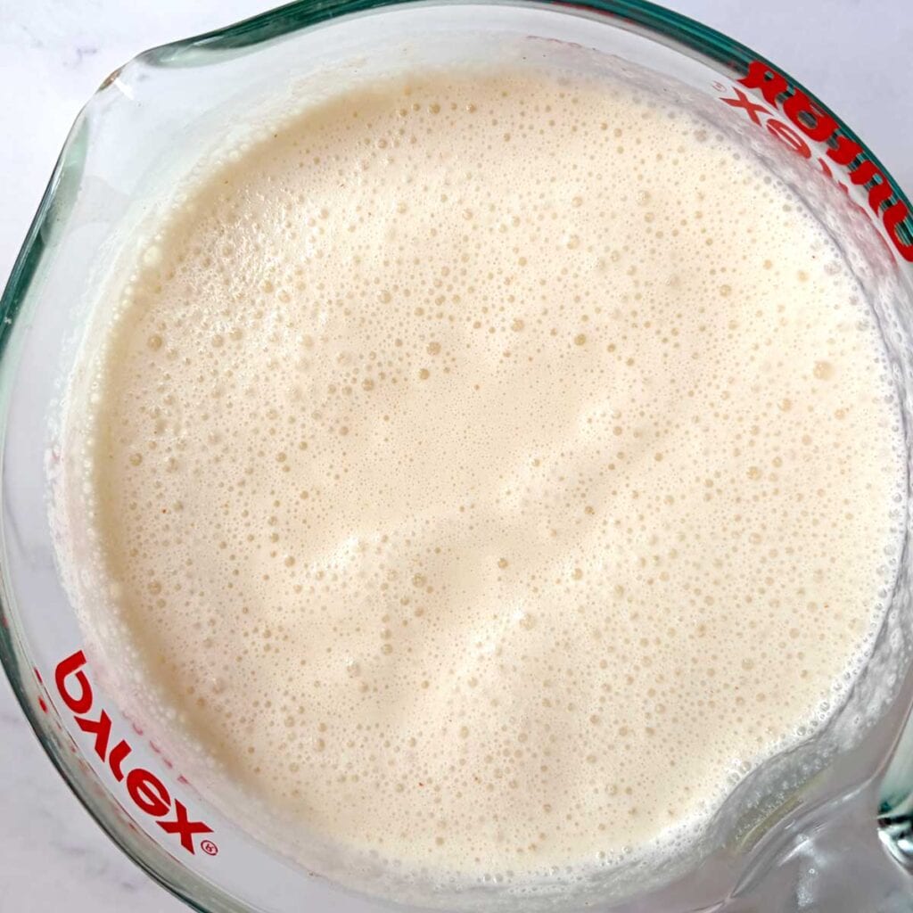 Lychee ice cream imix in a container.